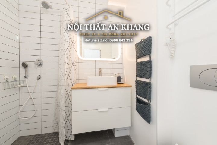 Căn hộ studio Japandi gỗ vàng – khách, bếp, bàn làm việc, phòng tắm – góc 18